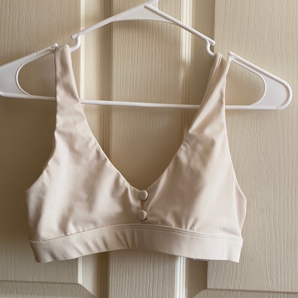 Kira Swimwear bikini top in size medium off white color